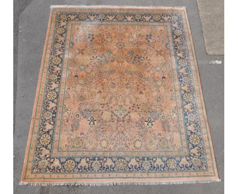 A 20th century Persian manner silk on wool carpet floor rug. The rug featuring an pale green ground with large central field 