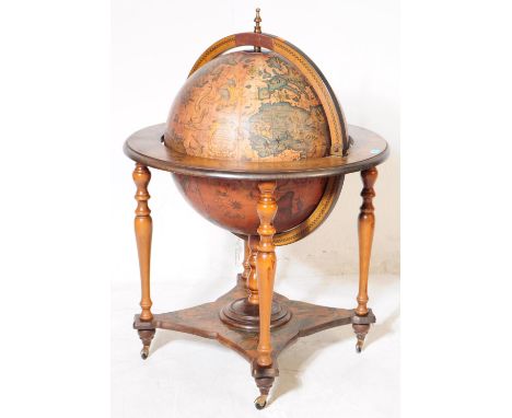 A 20th Century vintage mahogany veneer zodiac globe cocktail drinks cabinet / trolley. Having a hinged lid to globe top, open