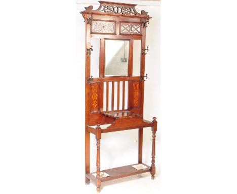 Victorian 19th century mahogany arts &amp; crafts inspired hall stand. The hall stand with central glove drawer over drop tra