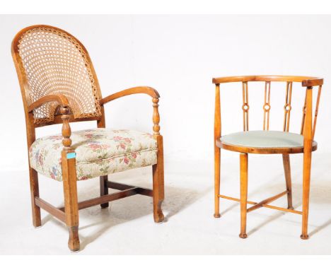 An Edwardian mahogany tub / corner armchair raised on turned legs with cross stretchers, pad seat and shaped elbow rest. Toge