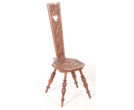 Early 20th century Welsh Art Nouveau carved oak spinning chair. The chair raised on four turned bobbin legs, with a octagonal