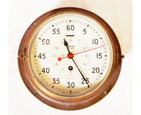 Smiths Astral - A 20th century nautical ships maritime engine room brass clock. Having white face with Arabic numbers. Glass 