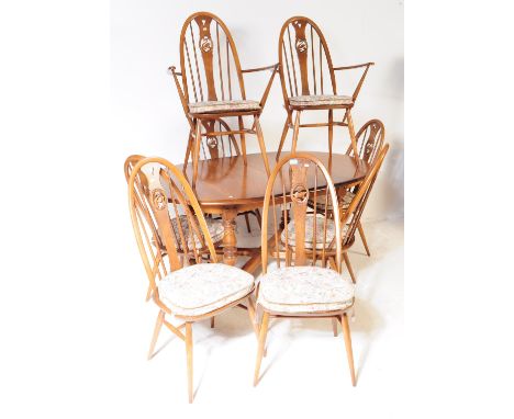 Ercol - Swan Pattern - Windsor - A 20th century Ercol golden dawn beech and elm dining suite having extending dining table of