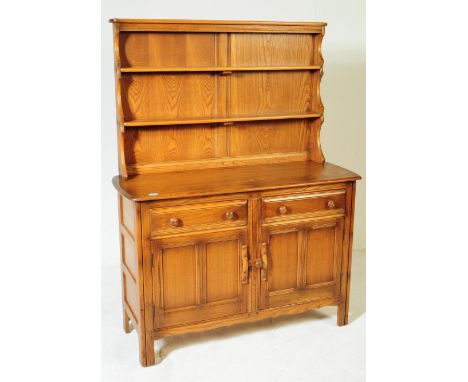 Ercol - Windsor - A mid 20th century Ercol Windsor beech &amp; elm dresser. The dresser having&nbsp;back with waterfall plate