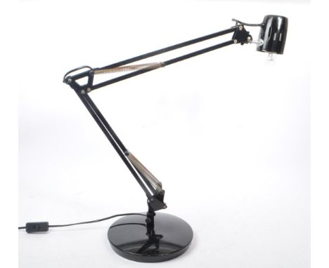 A vintage 20th century anglepoise table top inspectors lamp. The lamp having articulated arm overweight circular base.&nbsp;