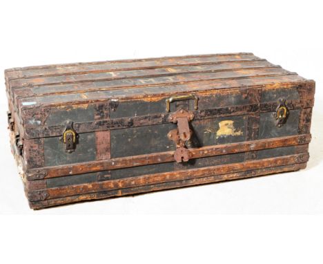 An early 20th century metal mounted trunk / chest. Rectangular form with metal clasp fixings with oak wooden frame support. M