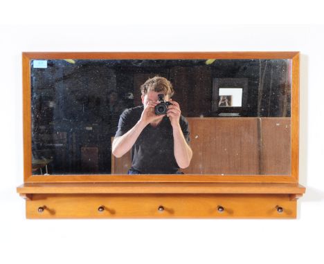 A contemporary British Modern Design manner wall mounted hall mirror. The mirror having a large glass mirror pane, encompasse