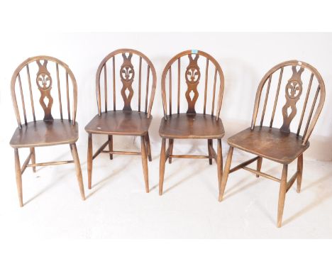 Lucian Ercolani for Ercol Furniture - A set of 4 Ercol fleur de lys pattern beach and elm wood hoop back dining chairs. Turne