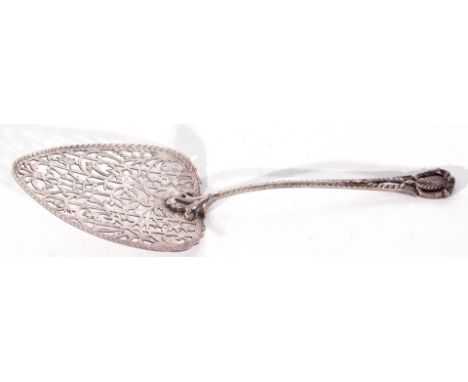George III silver fish slice/pudding trowel, with a spade shaped blade, embellished with finely pierced and engraved scrollin