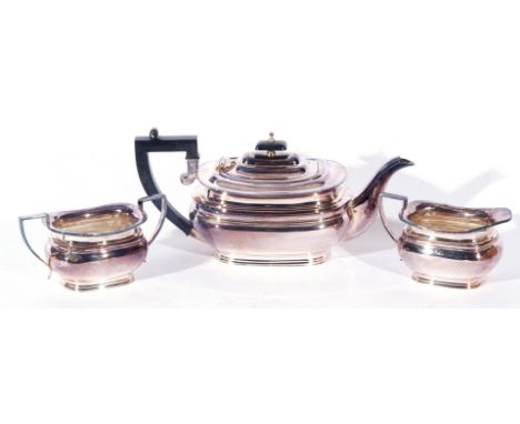 Queen Elizabeth II silver three piece tea service comprising tea pot with hinged lid and ebonised handle and lid finial, doub