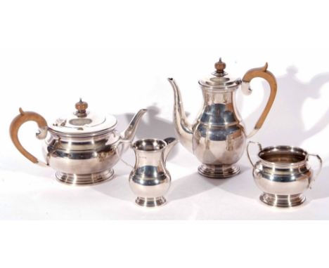 George VI four piece silver tea and coffee service, in the Regent pattern,  comprising tea and coffee pots with hinged lids w