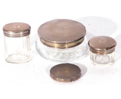 Mixed Lot comprising three clear glass and silver topped dressing table jars, a further silver mounted powder compact, all pi
