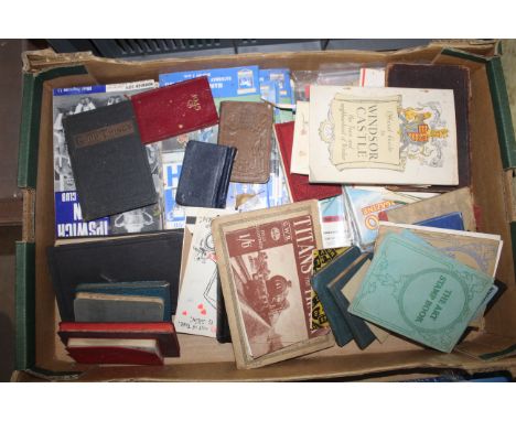 A box containing Ipswich Town football programmes, vintage diaries, Windsor Castle Guide etc.