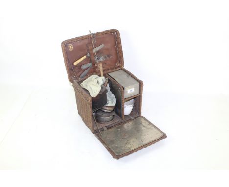 A vintage wicker basket camping set with Primus Stove and various contents 