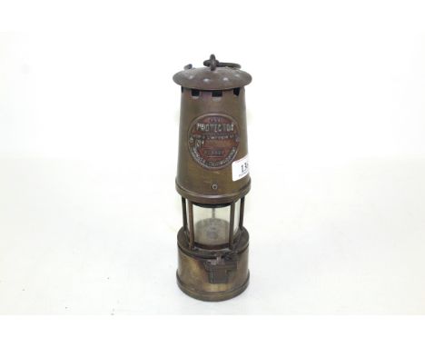 The Protector brass miner's lamp, by the Lamp and Lighting Co. Ltd of Eccles Manchester 