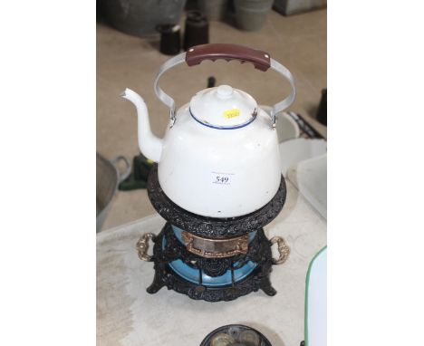 A very decorative cast iron and blue enamel double burner paraffin heater with enamel kettle 