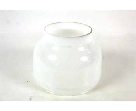 An opaque glass shade for a Tilley table lamp