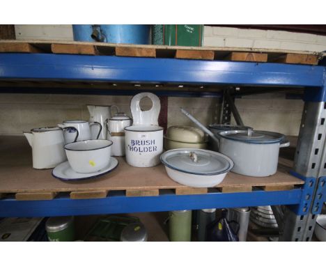 A large quantity of enamel kitchenware including a brush holder, saucepans, roasting pan, milk can, jugs etc.