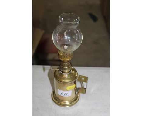A small French Olympe brass pigeon lamp, used by French winemakers as a night light 