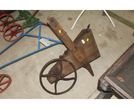 A vintage wooden bean drill