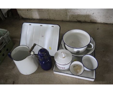 A quantity of enamel ware to include enamel tray, enamel draining board, enamel jug etc.
