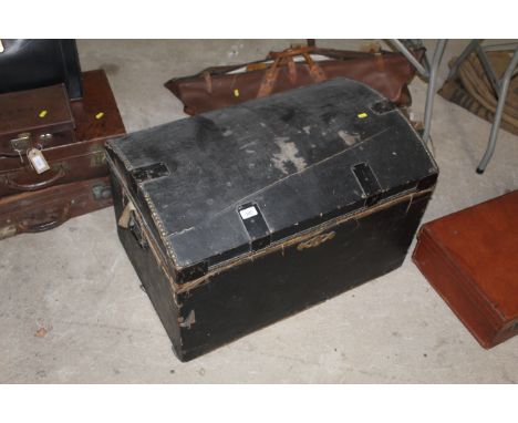 A wooden lined dome topped trunk lacking internal tray 
