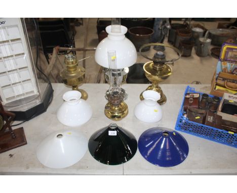 A chrome oil lamp, various other oil lamps and shades 
