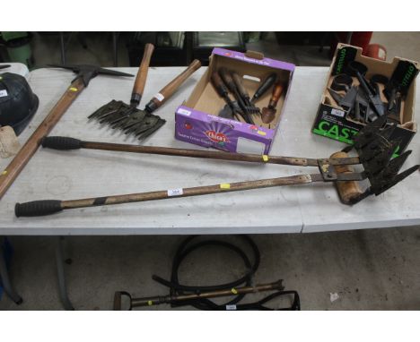 A multi bladed long handled grass cutter with wooden roller 