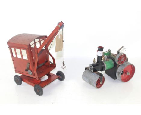 A Tri-ang tin plate crane and a Mamod steam roller 