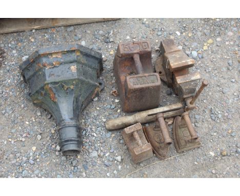 A 56lb Avery weight, a rain hopper, a Record bench vice, two flat irons and a 7lb cast iron weight 