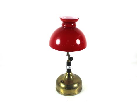 A "Colman's Quick Lite" table lamp with brass tank and an early red shade 