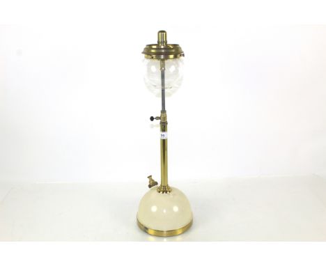A Tilley long stem table lamp with cream base and glass shade