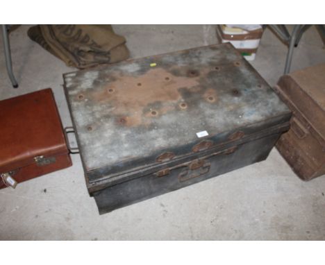 A riveted galvanised trunk with twin handles with red painted interior 