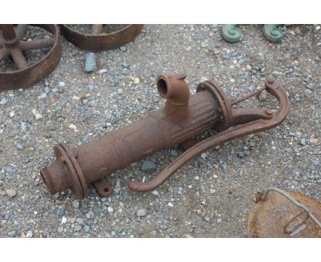 A vintage cast iron hand pump