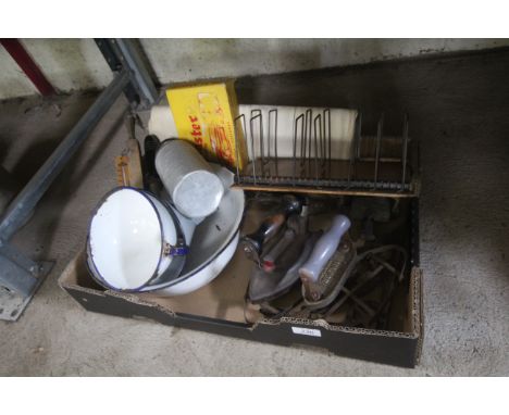A box containing an adjustable letter rack, vintage irons, enamel ware, thermometer etc.