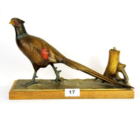 A 1930's bronzed and cold painted metal pheasant strike lighter, L. 31cm.