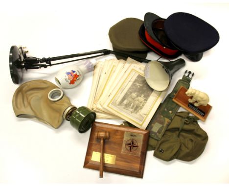 A box of mixed military related items and anglepoise lamp.