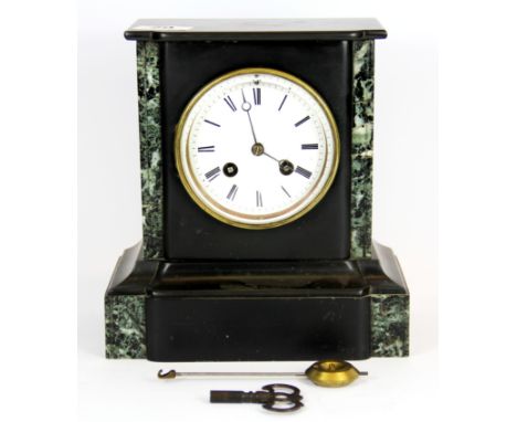 A 19th century French slate and marble mantle clock, H. 22cm.