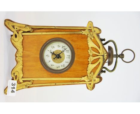 A pretty satin wood and gilt Art Nouveau alarm clock, H. 31cm.