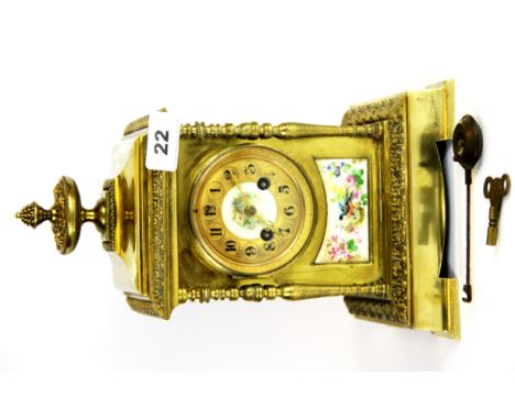 An early 20th century French gilt brass and porcelain mantle clock, H. 29cm.