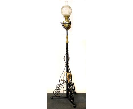 A superb Hinks brass and cast iron oil lamp and telescopic stand, photographed H. 185cm (adjustable).