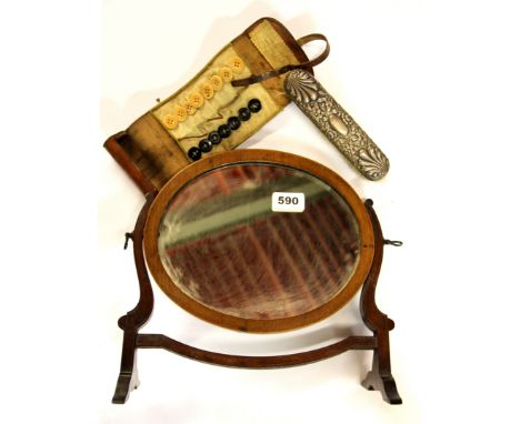 A small Regency mirror, a silver backed brush and a leather button roll.