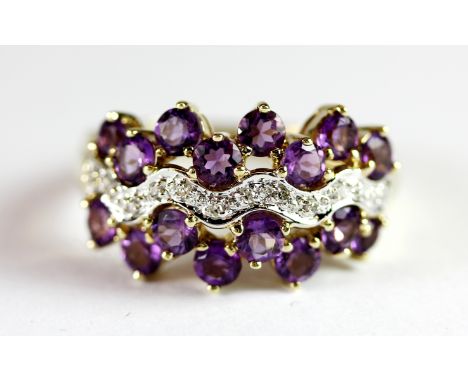 A 9ct yellow gold amethyst and diamond set ring, (P.5).