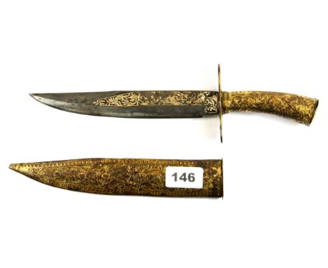 An Arabian dagger with gilt copper scabbard and hilt, L. 32cm.