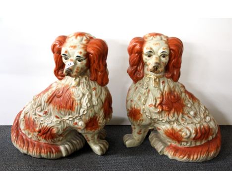 A pair of very large Staffordshire style ceramic spaniel figures, H. 58cm.