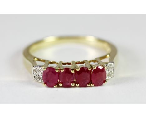 A 9ct yellow gold ruby and diamond set ring, (L).