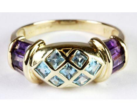 A large 18ct yellow gold amethyst and blue topaz set ring, (S.5).