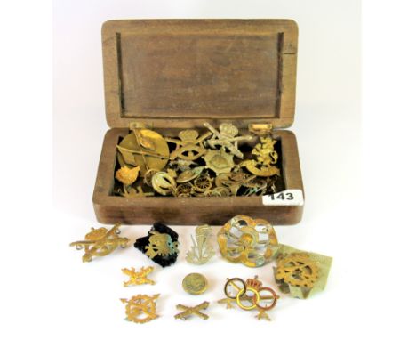 A hardwood box with Mahratta Light Infantry badge engraved into the lid together with a collection of military and other badg