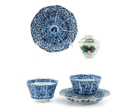 Including a pair of blue and white cups and saucers and Famille Rose cup with cover, chip and hairline.
