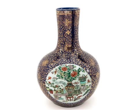 Dark blue ground with gilt floral decor, decorated with 3 scenes in Famille Verte enamels depicting landscapes and Chinese an